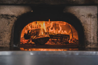 Wood burning in pizza oven