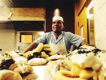 Portrait of man having food in store