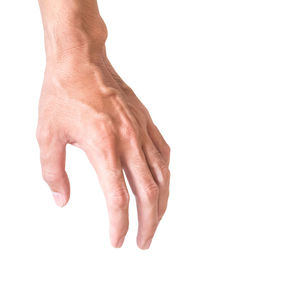 Close-up of hands over white background