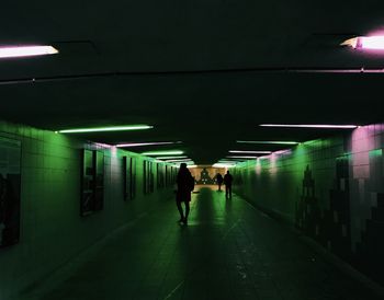 People walking in subway tunnel