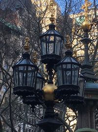 Low angle view of bare trees against sky