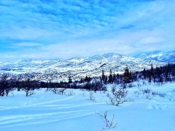 Scenic view of snowcapped mountains against sky