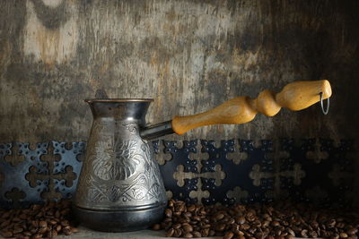 Close-up of food on table against wall