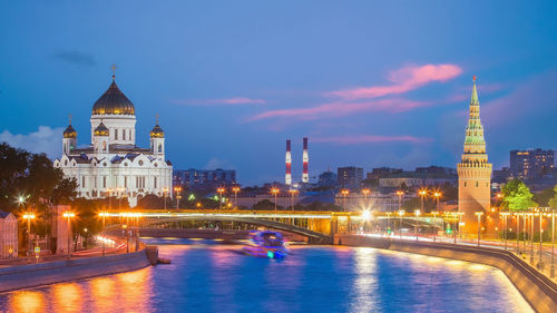 View of illuminated buildings against sky at night