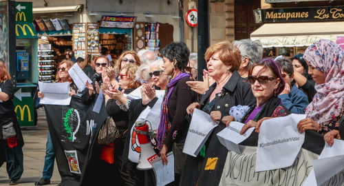 Group of people standing in city