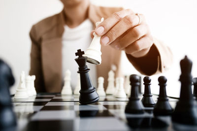 Close-up of man playing with chess