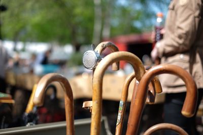 Close-up of walking cane for sale at market stall