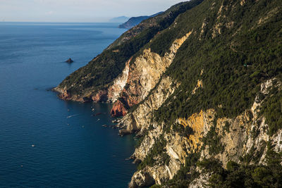 Seascape of cinque terre national park and red stone beach, protovenere, la spezia gulf, italy