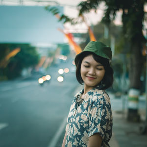 Portrait of smiling young woman pedestrian