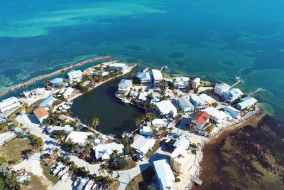 High angle view of buildings by sea