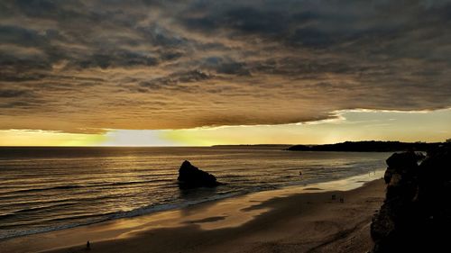 Scenic view of sea against sky at sunset