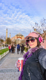 Woman standing against hagia sophia museum