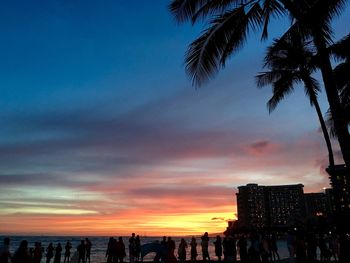 Silhouette of people at sunset