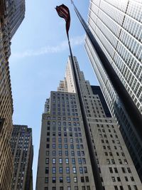 Low angle view of modern buildings against sky in city