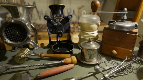 Old kitchen utensils on table at home