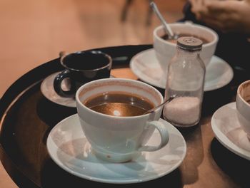 High angle view of coffee cups on table