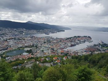 Cityscape against cloudy sky