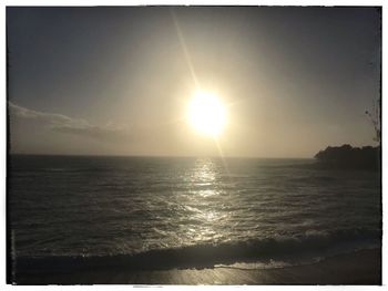 Scenic view of sea against sky at sunset