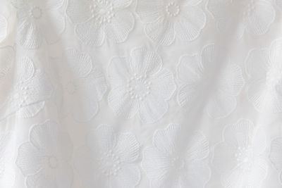 Full frame shot of floral patterns on white fabric