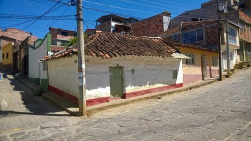 Buildings against blue sky and clouds