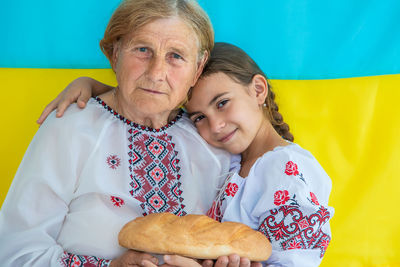 Portrait of smiling woman holding food