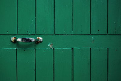 Close-up of green closed door