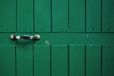 Close-up of green closed door