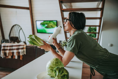 Woman holding food on table