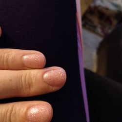 Close-up of woman hand on table