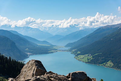 Scenic view of lake and mountains against sky