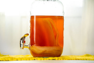 Close-up of beer glass on table