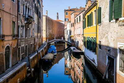 Boats moored in canal