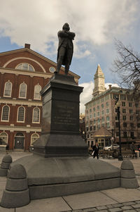 Statue of liberty in front of building