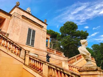 Low angle view of statue against building