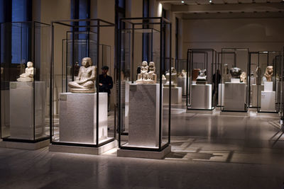 Rear view of people sitting in corridor