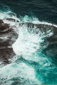 Waves splashing on rocks