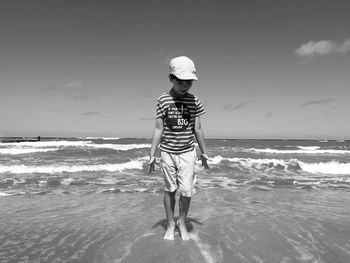 Woman standing on beach