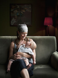 Woman sitting with baby, vietnam