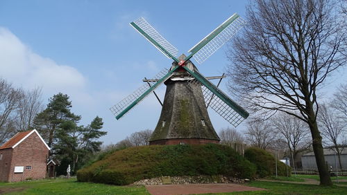 Traditional windmill against sky