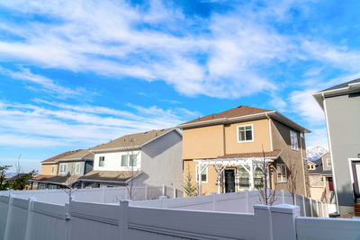 Low angle view of buildings against blue sky