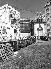 Cars on street against buildings in city