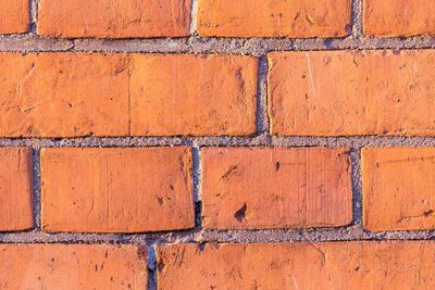 Full frame shot of brick wall on sunny day