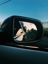 Reflection of car on side-view mirror