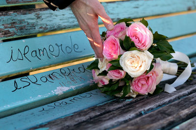 Close-up of rose on wooden wall