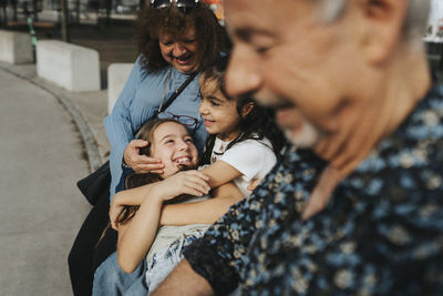 Girls enjoying with grandparents in city