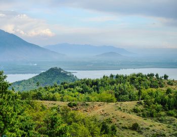 Scenic view of mountains and lake against sky