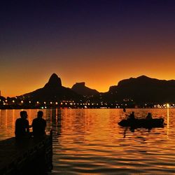 Scenic view of lake at sunset