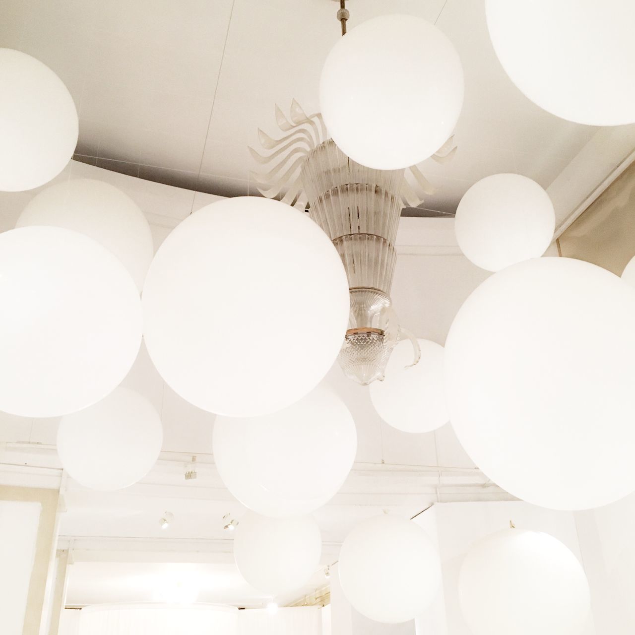 ceiling, white, indoors, lighting equipment, illuminated, low angle view, no people, hanging, architecture, close-up, day