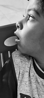 Portrait of teenage girl looking away at home