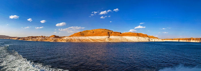 Scenic view of sea against blue sky